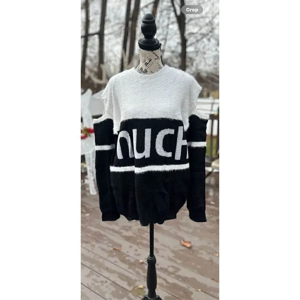 Oversized, cold shoulder, black and white fuzzy sweater.